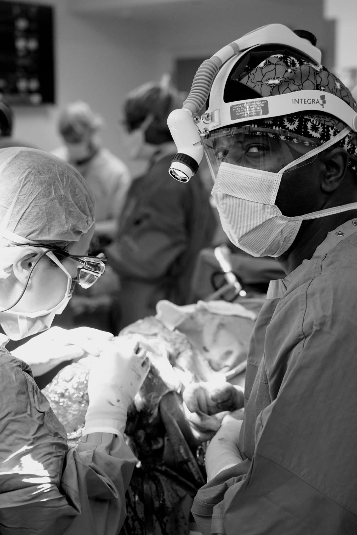Surgeons providing care in an operating room.
