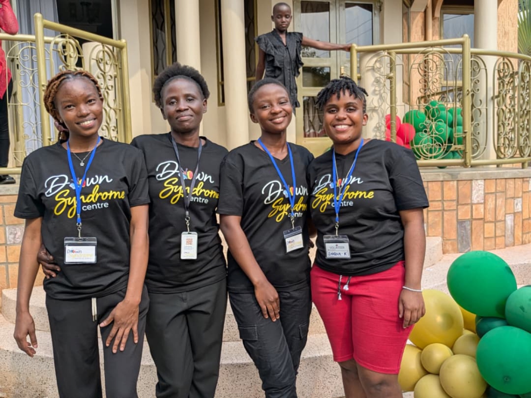 Down Syndrome Centre team members standing together at a community event.