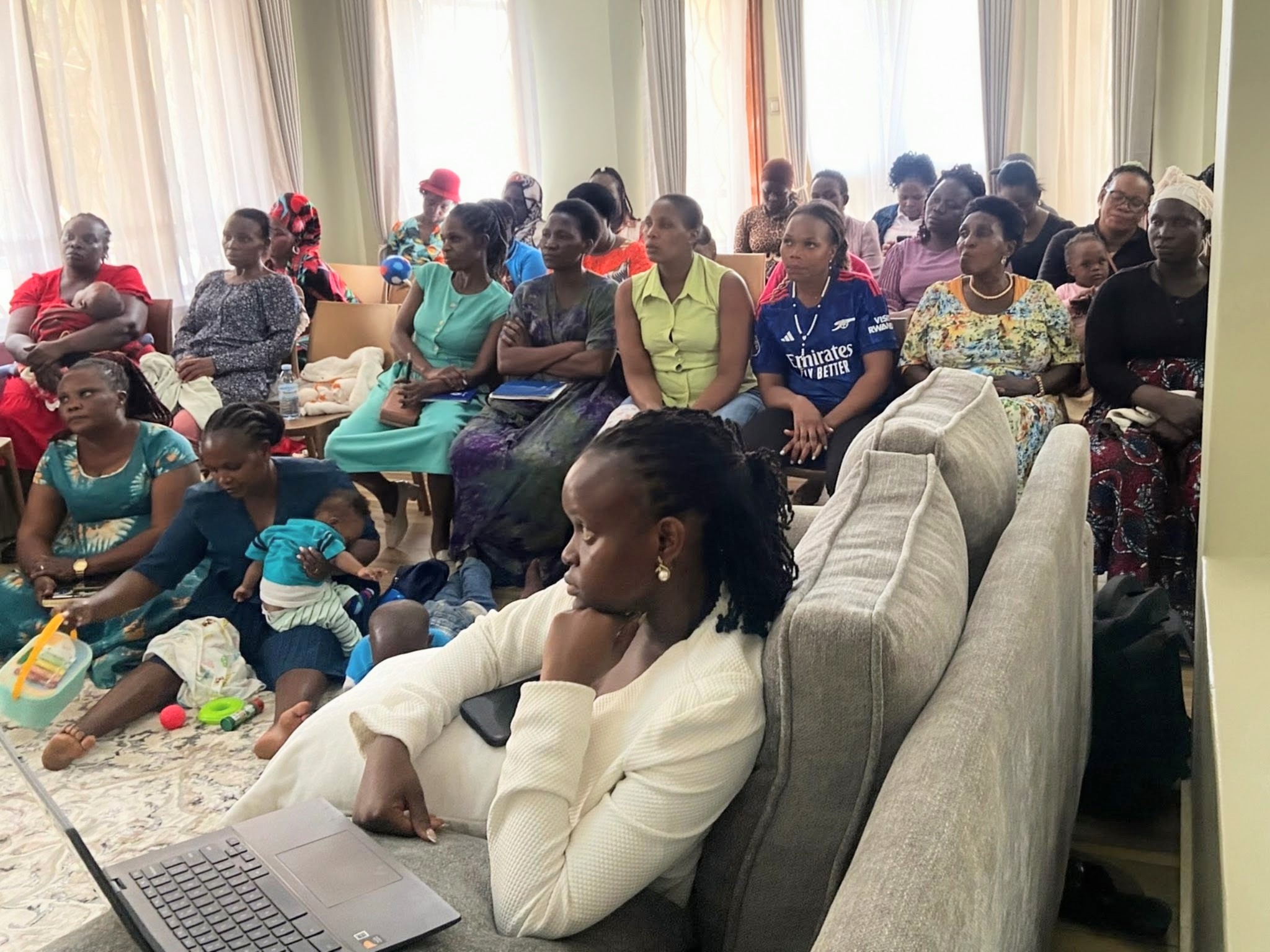 Families seated together during a Down Syndrome Centre workshop.