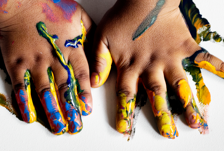 Paint-covered hands from the July 2026 Upasuaji International update.